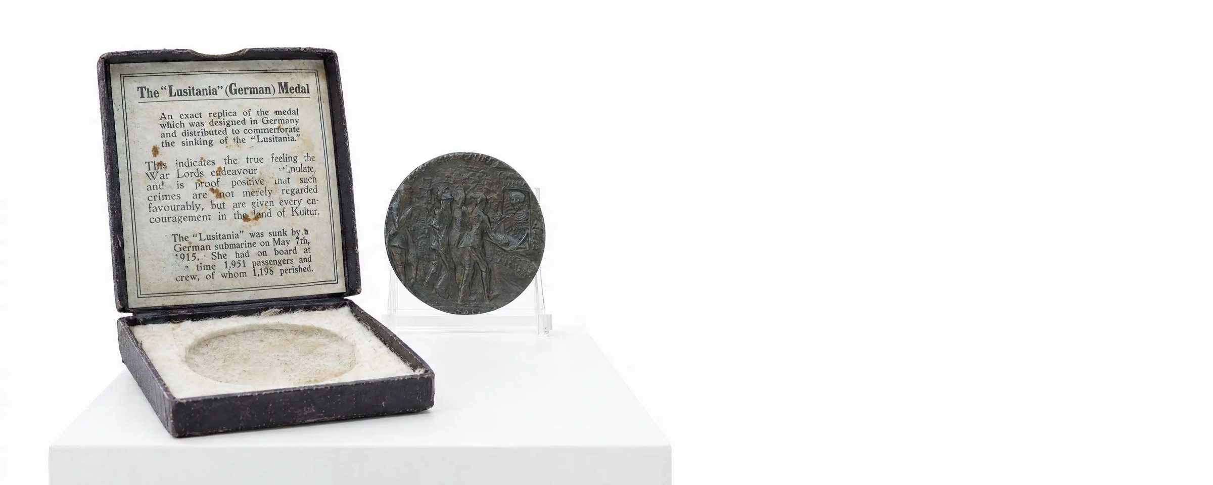 The cased Lusitania medal, a 1915 propaganda piece, with its printed explanatory card